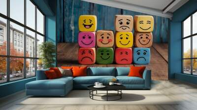 concept of Different emotions drawn on colorful cubes, wooden background. Wall mural