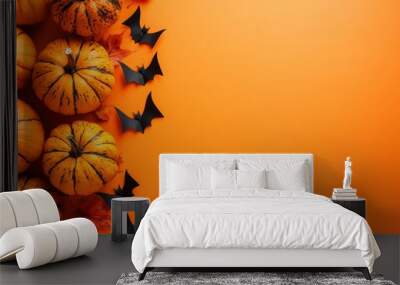 Halloween pumpkins and bats on orange background with copy space with generative ai Wall mural