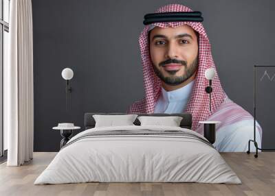 Handsome arab middle-eastern saudi arabian man with traditional saudi clothing in studio - Arabic muslim adult male businessman wearing thwab portrait isolated on gray background with generative ai Wall mural