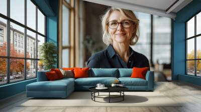 Happy mature business woman leader standing in office looking away. Smiling confident older middle aged professional lady corporate leader, senior female executive with generative ai Wall mural