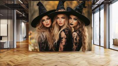 Three beautiful witch in halloween costumes with makeup on a background of the forest with generative ai Wall mural