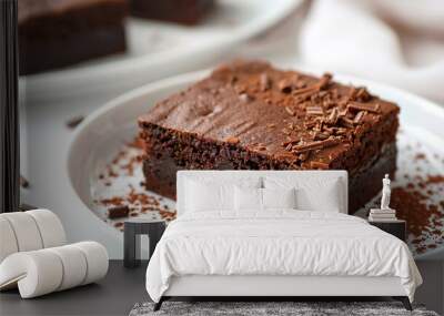 macro photography of chocolate brownie cake. a piece of chocolate brownie cake on white plate. Homemade dark chocolate cake cut in square Wall mural