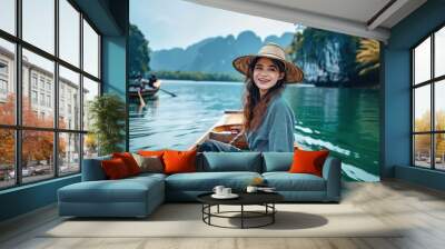 happy young woman tourist on the boat at lake Wall mural