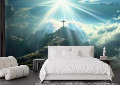 Christian inspiration: Crucifix on a mountain peak with sunlight and clouds, a breathtaking and meaningful image Wall mural