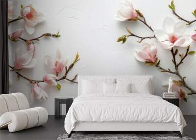 top view floral arrangement of magnolia flowers branches on a white background with copy space ideal for wedding and event decor Wall mural