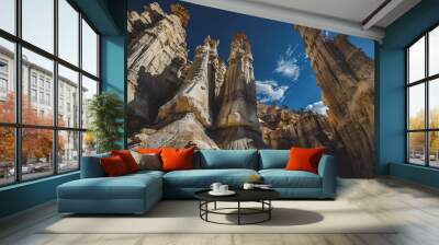 a view of towering erosion-formed hoodoos against a deep blue sky Wall mural