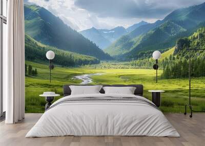 An expansive view of a green mountain range with a shimmering river in the valley, flanked by forests and meadows. Wall mural