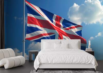 Flag of Great Britan being waved in the breeze against a sunset sky. Wall mural