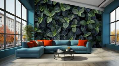 intricate pattern of small, dark green leaves, providing a detailed and captivating natural texture. Wall mural