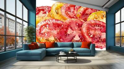 Juicy slices of red and yellow tomatoes, with drops of water on their surface, arranged in a circular pattern. isolated on white background. Wall mural