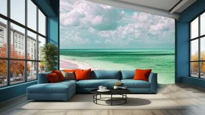 Serene beach with soft lavender sands and tranquil green waters, providing a wide space for text, ideal for travel and leisure themes. Wall mural