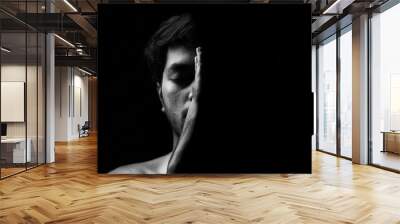 Dramatic portrait of a young guy on a black background, black and white photography, Dramatic Portrait, Light, Study of light Wall mural