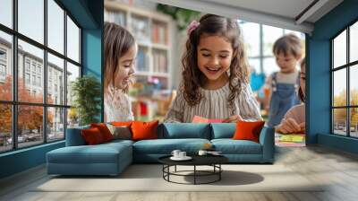 Three happy kids learning letters in a classroom setting. Wall mural