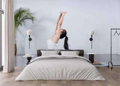 Asian girls stretch in minimalist rooms Wall mural