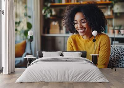 high-resolution brightly lit photorealistic candid photograph of: woman working from home on a laptop smiling because she's making money.. The photograph is styled like a high-end lifestle magazine.  Wall mural