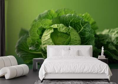 Close view of a green lettuce on green background Wall mural