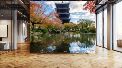 Ancient wood Toji temple reflection pond in maple leaves garden at Kyoto Wall mural