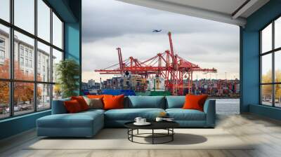 International cargo ship with containers cargo cranes and helicopter flying Wall mural