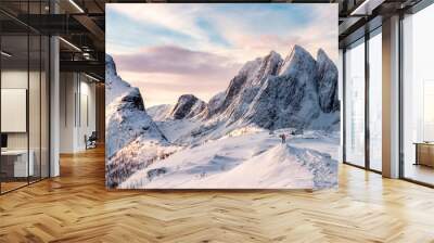 Panorama of Mountaineer standing on top of snowy mountain range Wall mural