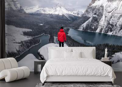 Traveler standing on rock over Opabin Plateau with lake O'hara in snowing at Yoho national park Wall mural