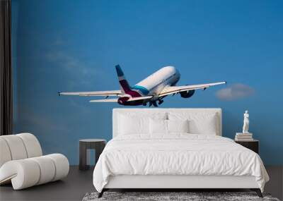 A Airplane after the takeoff Wall mural