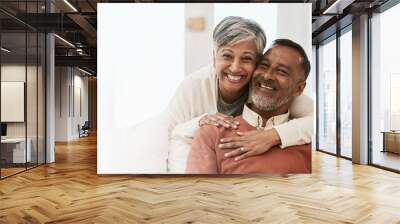 Portrait, smile and senior couple in home living room, bonding together and hug on mockup space. Happy face, man and Indian woman in lounge for care, love or support in healthy relationship at house Wall mural