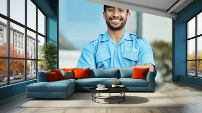 Asian man, portrait and security guard with arms crossed in city for career safety or outdoor protection. Male person, police or officer smile in confidence, law enforcement or patrol in urban town Wall mural