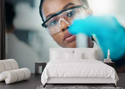 Science, study and black woman with test tube in laboratory, medical engineer and results. Biotechnology, pharmaceutical and research, scientist or lab technician checking vaccine solution in glass. Wall mural