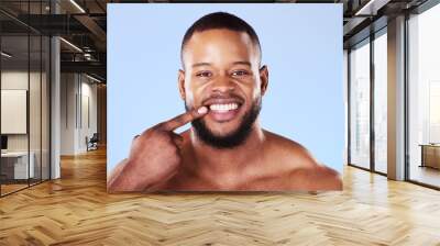 Teeth, dental care and portrait of black man mouth after cleaning or hygiene isolated in a blue studio background. Healthcare, dentist and happy person showing his oral beauty smile for health Wall mural