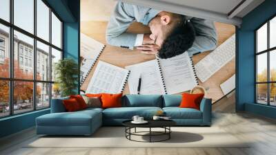 Top view, burnout and tired or man with sleeping at desk and exhausted at finance job. Employee, depressed and rest on table at work with fatigue or accountant with stress in office with documents. Wall mural