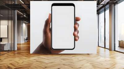 Black man's hand holding mobile cell phone with blank screen for mockup design prototype isolated on a white background Wall mural