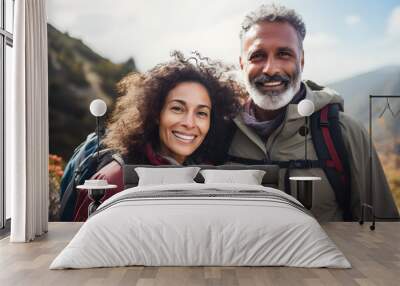 Happy senior mixed race couple hiking in a national park Wall mural