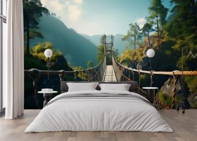 A scenic suspension bridge connecting lush green mountains. Wall mural