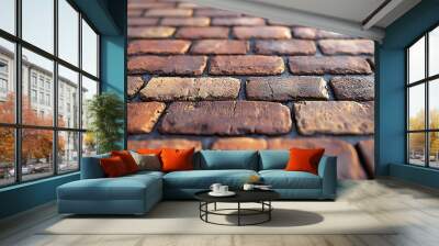 Close-up view of textured brick pavement in warm tones. Wall mural