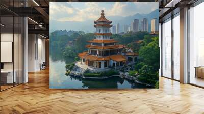 Traditional Chinese Pagoda on an island in a park with a lake and mountains in the background. Wall mural