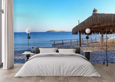 Fences and boat on the beach of palamut buku bay in Datca, Turkey Wall mural