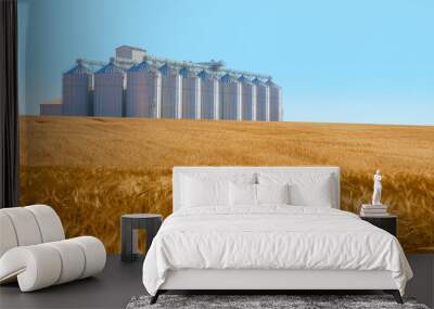 Agricultural Silos for storage and drying of grains, wheat, corn, soy, sunflower - Big round bales of straw in the meadow - Harvested field with straw bales in summer Wall mural