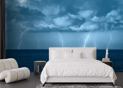 Beautiful landscape with lightning over the calm sea at sunset  Wall mural