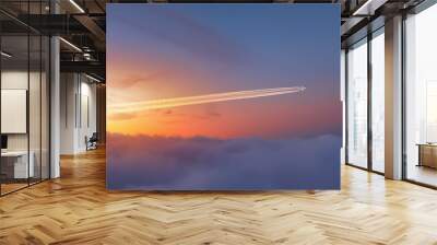 Jet airplane with trail of fuel on blue sky  Wall mural