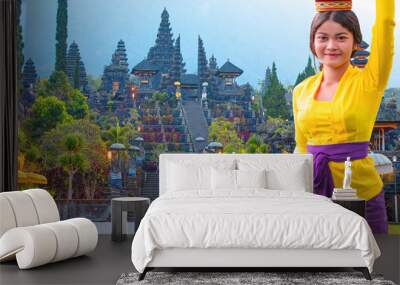 Portrait of balinese girl in traditional costume - Bali style roof of Pura Besakih temple on the slopes of Mount Agung largest and holiest temple in Bali Wall mural