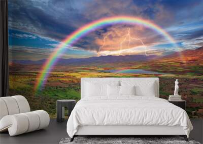 Rainbow over the valley with lightning Wall mural