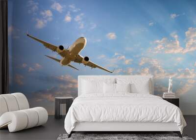 White passenger airplane flying in the sky amazing clouds in the background - Travel by air transport Wall mural