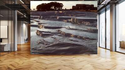 The stunning travertine terraces of Pamukkale at sunset Wall mural