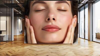 A captivating portrait featuring a woman modeling makeup, ideal for promoting face wash products, her hand delicately touching her fresh face. Wall mural