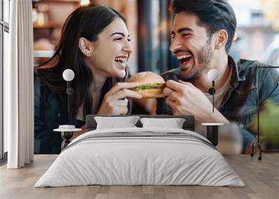 Couple Sharing a Burger at Restaurant Wall mural