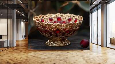 Ornate gold bowl with red gems. Wall mural