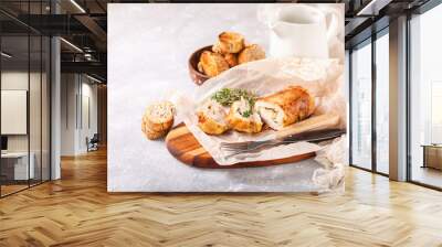 Chicken roll and vegetables on a table. Selective focus. Copy space Wall mural