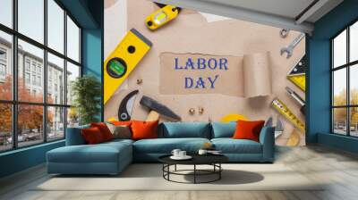 Set of different yellow repair tools on kraft paper background with hole and Text Labor Day Wall mural