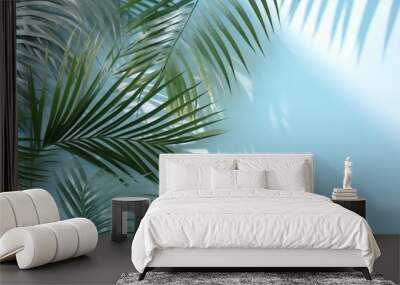 Blurred shadow from palm leaves on the light blue wall. Minimal abstract background for product presentation. Spring and summer Wall mural