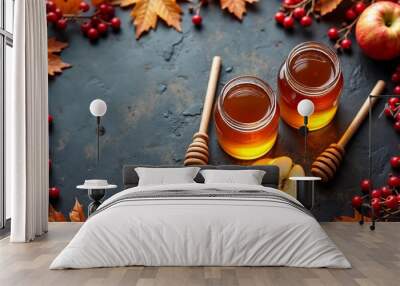 Two Jars of Honey with a Honey Dipper, Sliced Apples, and Autumn Leaves on a Dark Background for Seasonal Culinary Inspiration Wall mural